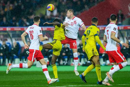 Alexander Isak of Sweden and Kamil Glik of Poland