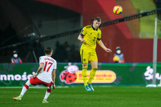 Sebastian Szymanski of Poland and Emil Krafth of Sweden