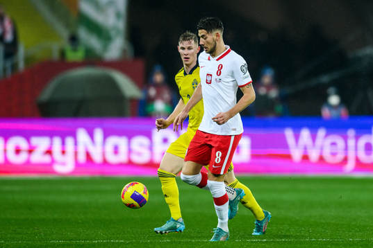 Emil Krafth of Sweden and Jakub Moder of Poland