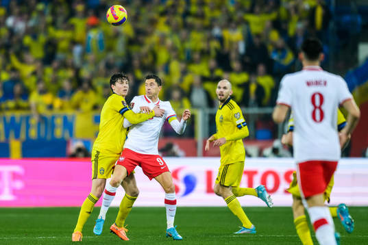 Victor Nilsson Lindelöf of Sweden and Robert Lewandowski
