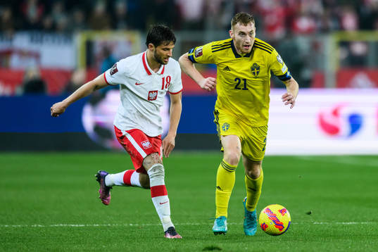 Bartosz Berezynski of Poland and Dejan Kulusevski of Sweden