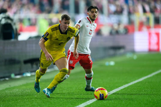 Emil Krafth of Sweden and Jakub Moder of Poland