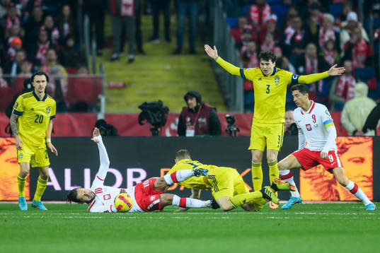 Grzegorz Krychowiak of Poland and Jesper Karlström of
