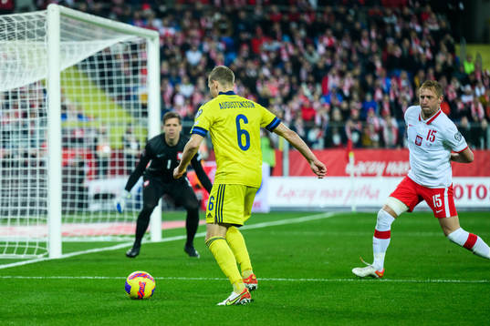 Ludwig Augustinsson of Sweden and goalkeeper Wojciech