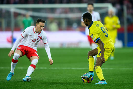 Piotr Zielinski of Poland and Alexander Isak of Sweden