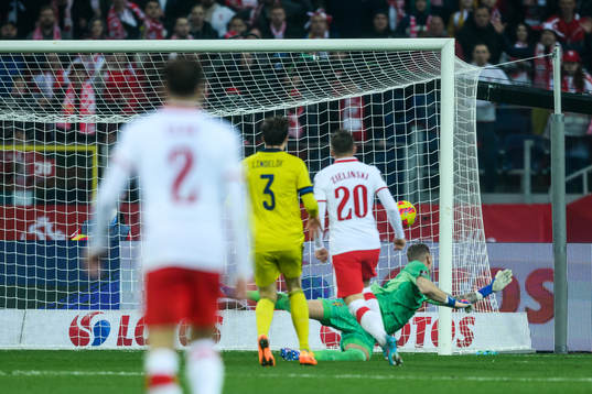 Piotr Zielinski of Poland scores 2-0 against goalkeeper