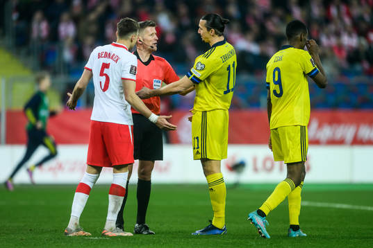 Jan Bednarek of Poland, referee Daniele Orsato and Zlatan