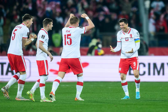 Kamil Glik and Robert Lewandowski of Poland celebrate