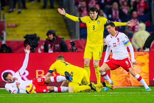 Piotr Zielinski of Poland falls in a duel with Jesper