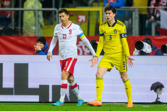 Robert Lewandowski of Poland and Victor Lindelöf of Sweden