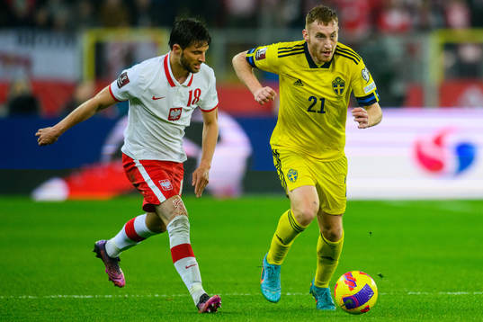 Bartosz Berezynski of Poland and Dejan Kulusevski of Sweden