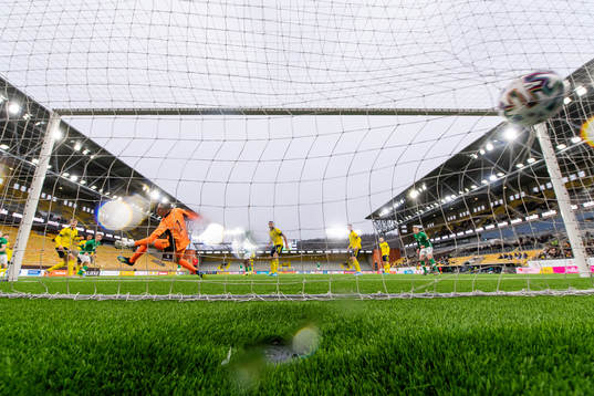 Ross Tierney of Ireland scores 0-1 behind goalkeeper Samuel