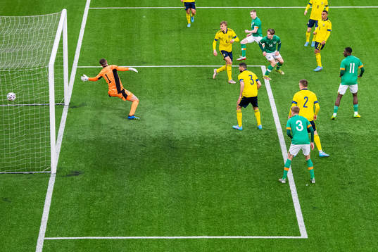 Ross Tierney of Ireland scores 0-1 behind goalkeeper Samuel
