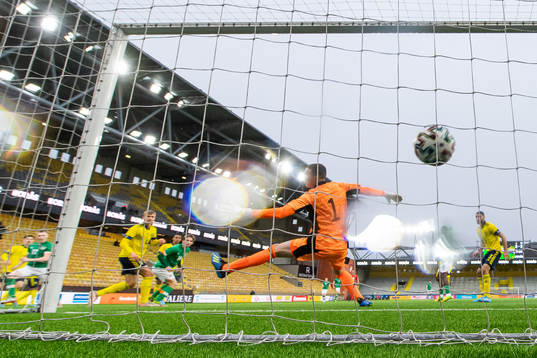 Ross Tierney of Ireland scores 0-1 behind goalkeeper Samuel