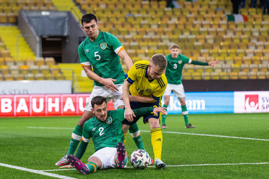 Oisin McEntee and Lee O'Connor of Ireland compete for the