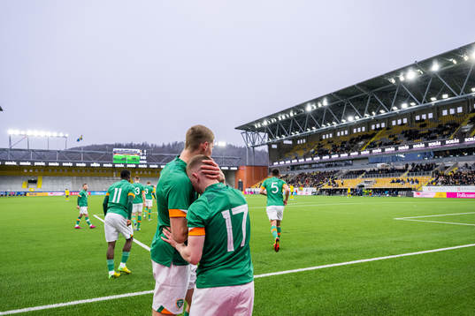 Mark McGuinness celebrates with Ross Tierney of Ireland who