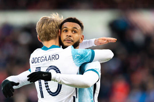 Martin Ødegaard and Joshua King of Norway celebrate the