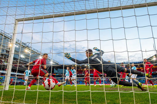 Joshua King of Norway scores the 3-0 goal behind goalkeeper