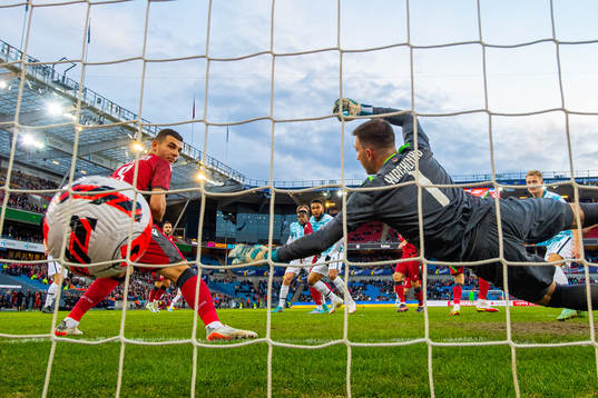 Joshua King of Norway scores the 3-0 goal behind goalkeeper