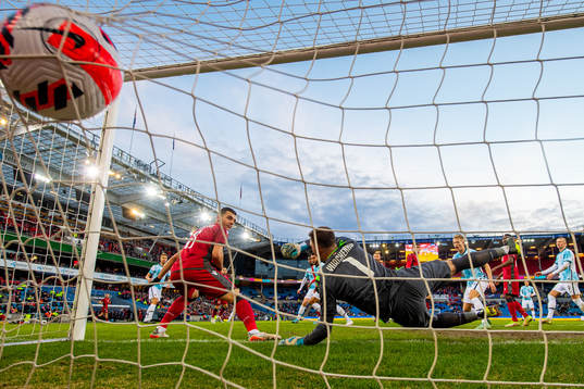 Joshua King of Norway scores the 3-0 goal behind goalkeeper