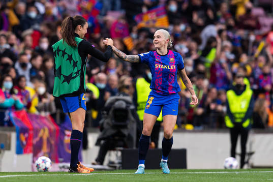 Ingrid Syrstad Engen and Mapi Leon of Barcelona celebrate