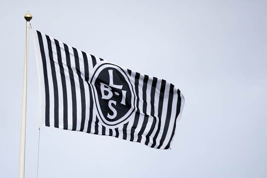 Flagga med Landskronas emblem
