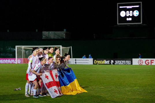 Players of Georgia with the flags of Georgia and Ukraine