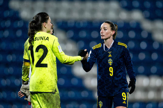 Goalkeeper Tatia Gabunia of Georgia and Kosovare Asllani of