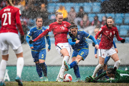 Frida Maanum of Norway scores the 3-0 goal past Edona
