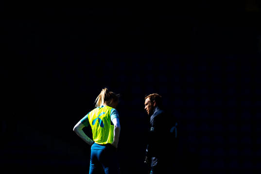 Ada Hegerberg listens to Martin Sjögren, head coach of the