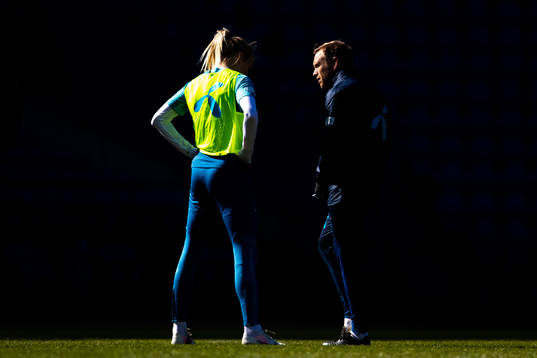Ada Hegerberg listens to Martin Sjögren, head coach of the