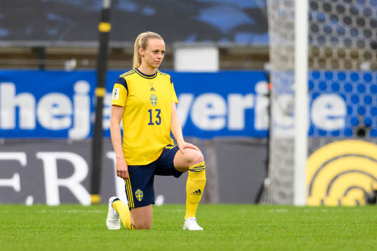 Amanda Ilestedt of Sweden takes a knee in support of the