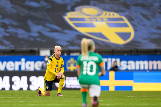 Caroline Seger of Sweden takes a knee in support of the