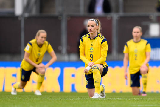 Kosovare Asllani of Sweden takes a knee in support of the