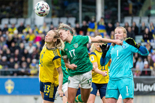 Amanda Ilestedt of Sweden against Jamie Finn and goalkeeper