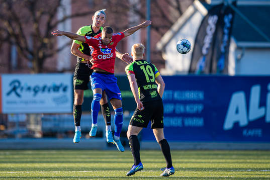 Fredrik Pallesen Knudsen of Brann and Johnny Buduson of