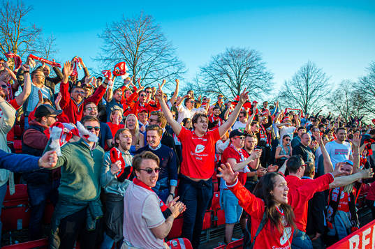Spectators in the stands celebrates
