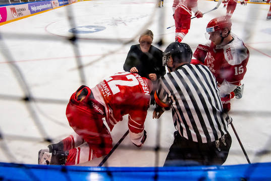 Markus Lauridsen of Denmark receives medical attention