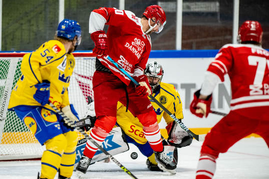 Mathias Bau Hansen of Denmark and goalkeeper Jhonas Enroth