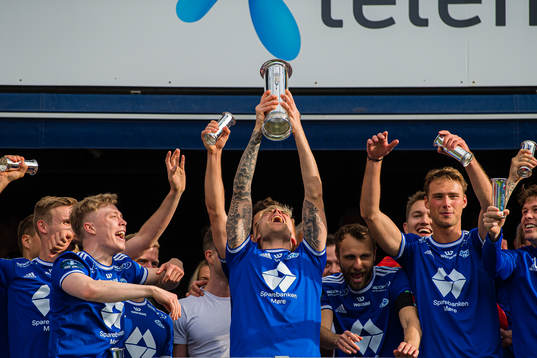 Eirik Ulland Andersen of Molde celebrates with the trophy