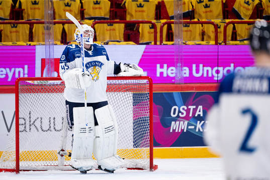 Goalkeeper Jussi Olkinuora of Finland looks dejected