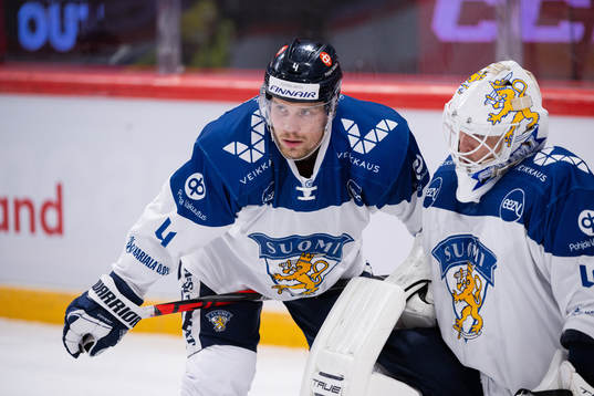 Mikko Lehtonen and goalkeeper Jussi Olkinuora of Finland