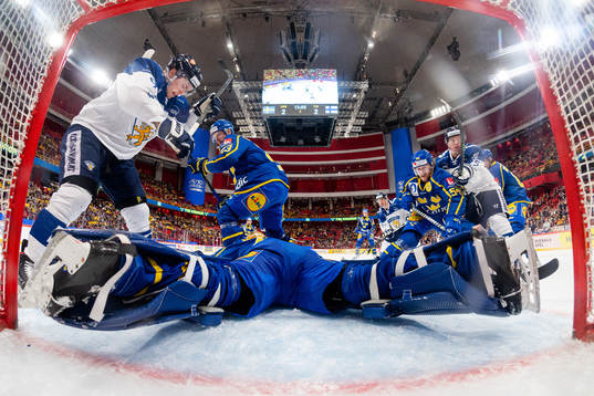 Oliver Ekman-Larsson, goalkeeper Magnus Hellberg and Anton