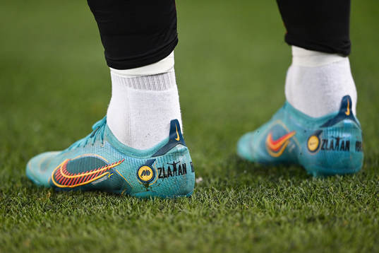 A pair of football shoes with the text Zlatan