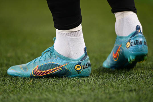 A pair of football shoes with the text Zlatan