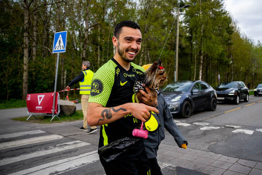 Niklas Castro of Brann with a dog
