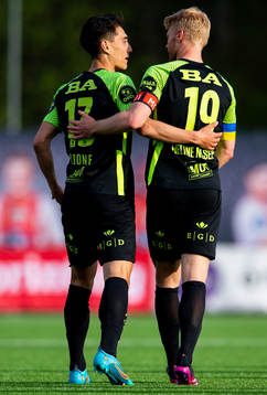 Svenn Crone of Brann celebrates with teammate Sivert Heltne