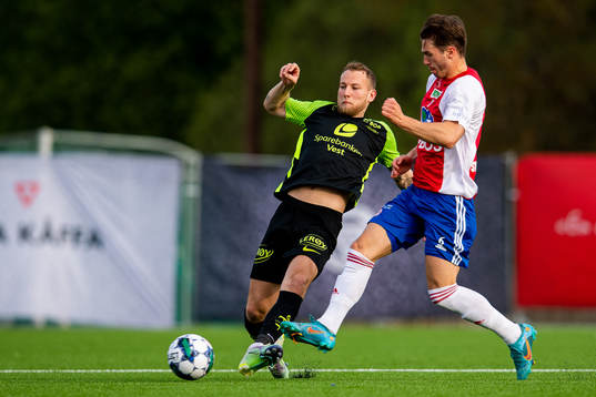 Andreas Skovgaard Larsen of Brann and Remi-André Svindland