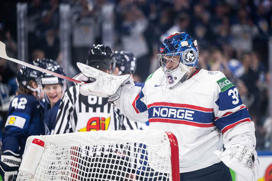 Goaltender Henrik Haukeland of Norway looks dejected