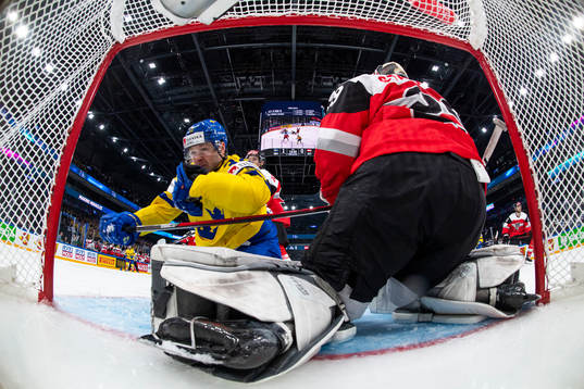 Lucas Wallmark of Sweden and goaltender Bernhard Starkbaum